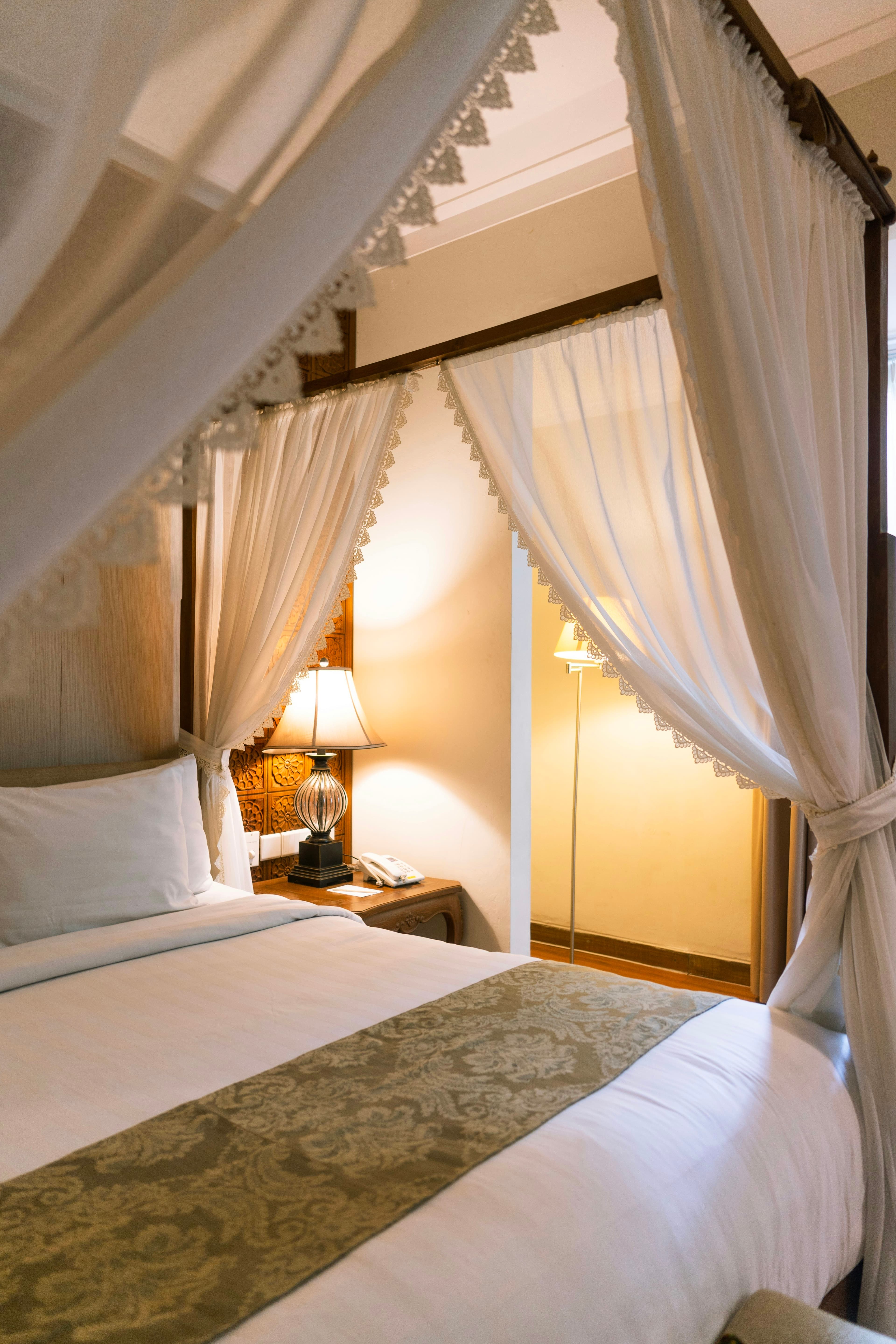 Premium bedroom interior with custom wardrobe, upholstered headboard, and ambient lighting